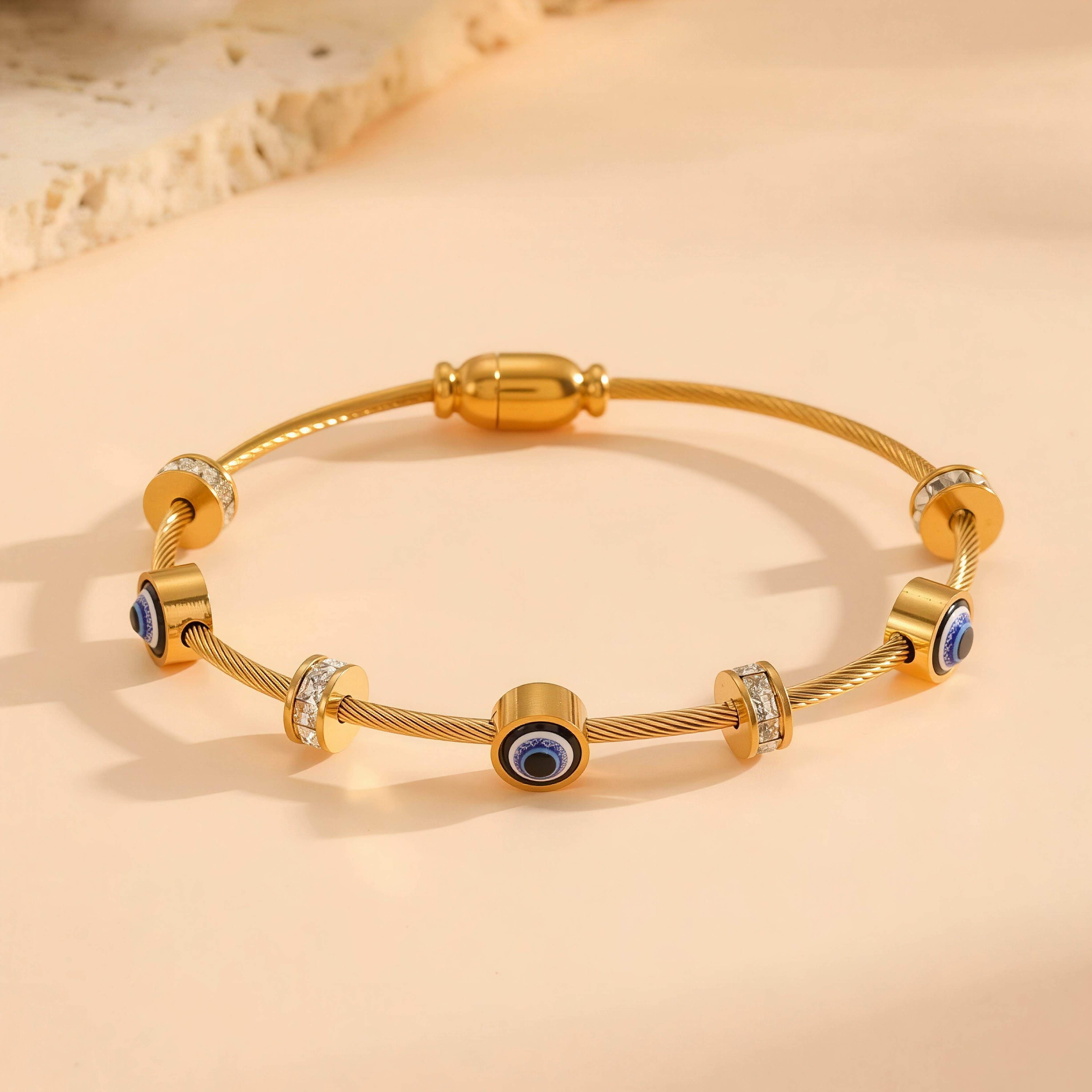 Nadia evil eye bangle, gold plated
